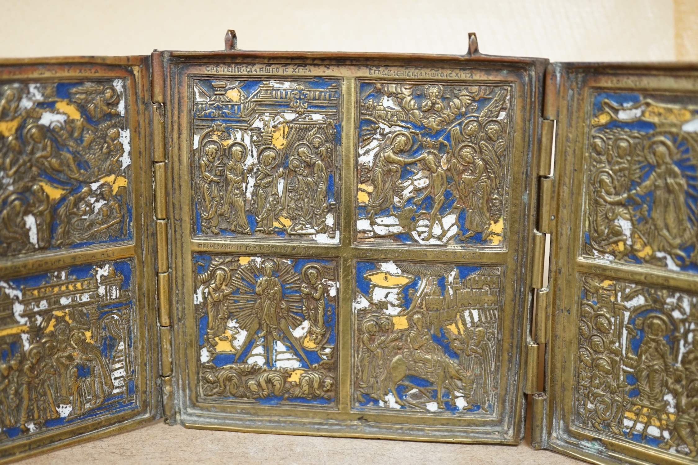 Two Russian Orthodox Church bronze and enamel triptych icons, largest 11cm high. Condition - fair